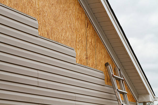 Professional Vinyl Siding technician working in Madison, IN